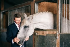 groom portrait with his horse