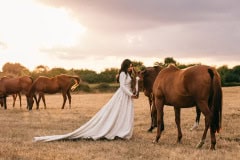 bride with horses in Cotswolds